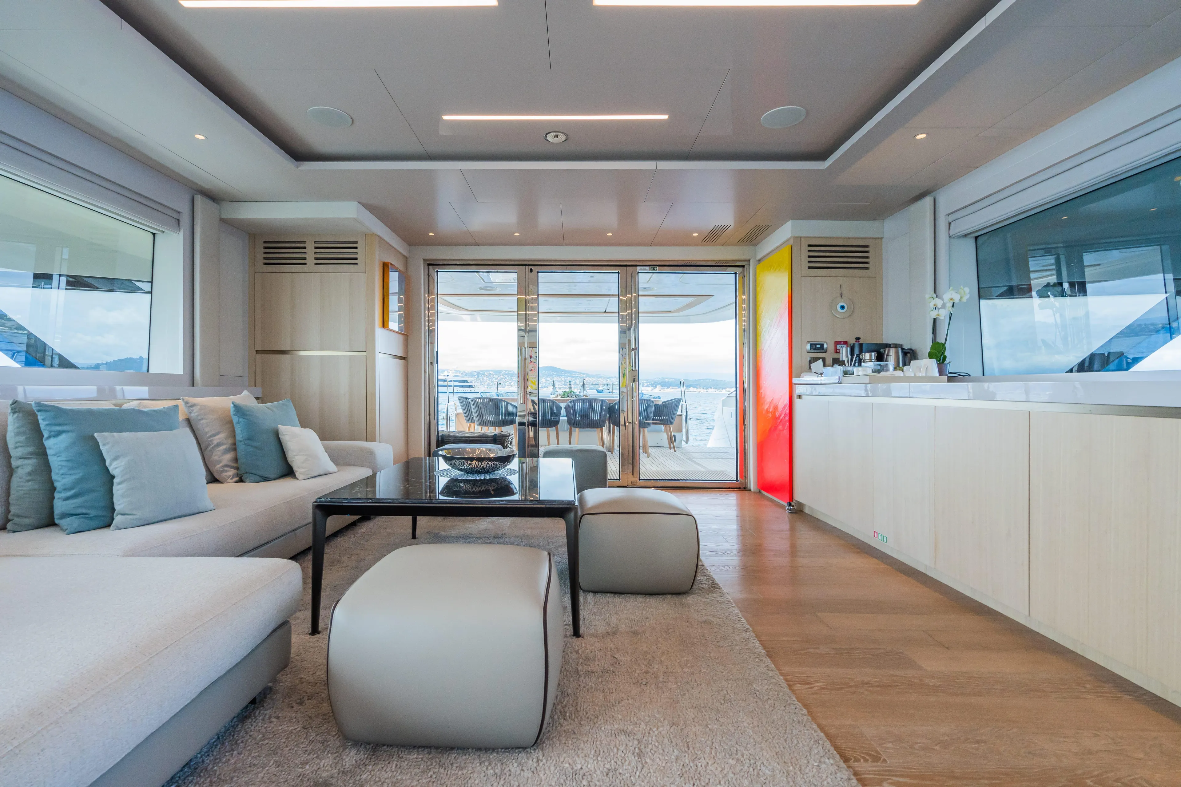 Rocco Yacht Photos Pics Luxurious interior of 2021 Monte Carlo Yachts MCY 96 with modern furnishings and ocean view.