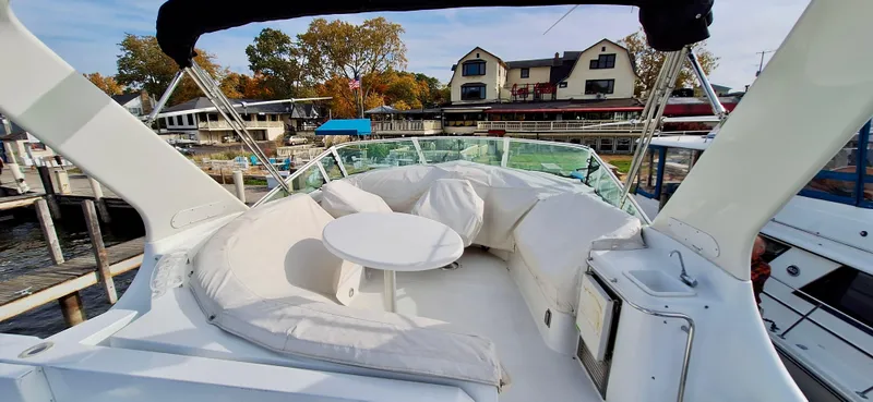 Regina Rae Yacht Photos Pics 1999 Carver 450 Voyager Pilothouse yacht with spacious outdoor seating area.