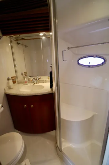 Regina Rae Yacht Photos Pics Bathroom interior of 1999 Carver 450 Voyager Pilothouse with shower and vanity.
