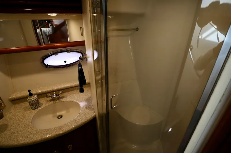 Regina Rae Yacht Photos Pics Bathroom interior of 1999 Carver 450 Voyager Pilothouse with sink and shower.