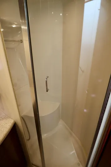 Regina Rae Yacht Photos Pics Shower area in 1999 Carver 450 Voyager Pilothouse yacht, featuring glass door and modern design.