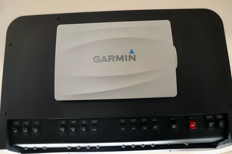 Regina Rae Yacht Photos Pics Garmin navigation panel on 1999 Carver 450 Voyager Pilothouse boat dashboard.