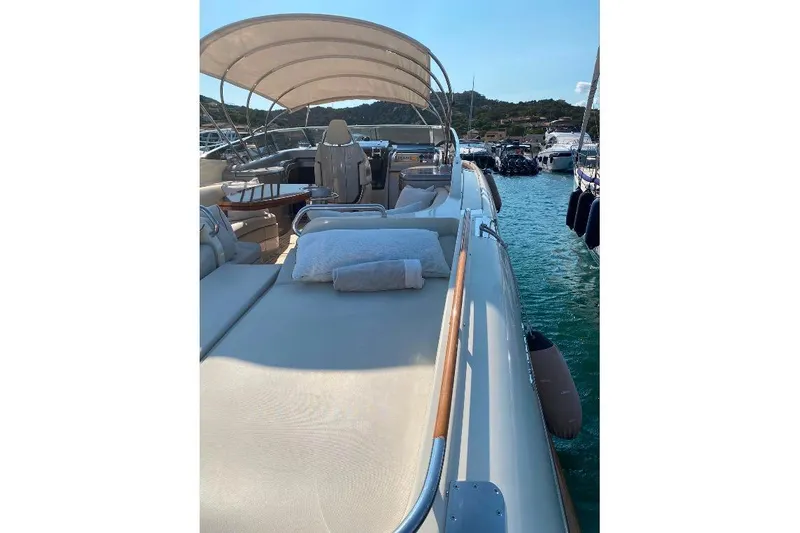  Yacht Photos Pics 2008 Riva RivaRama 44 luxury yacht with sunbed and canopy on calm water.