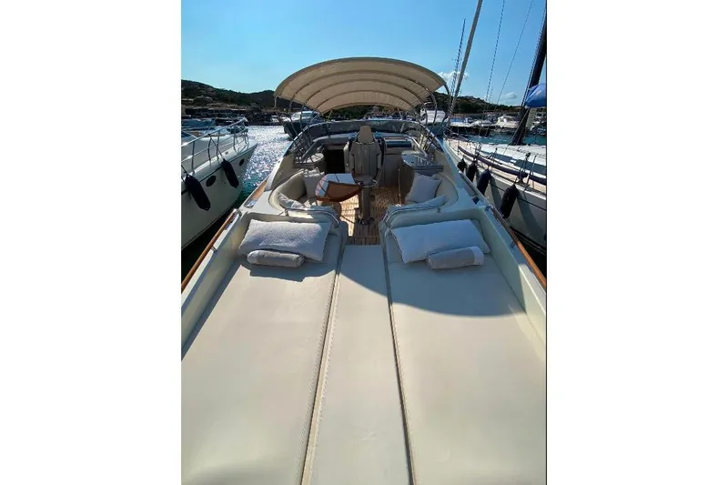  Yacht Photos Pics Luxurious 2008 Riva RivaRama 44 yacht with sunbathing deck and elegant seating area.