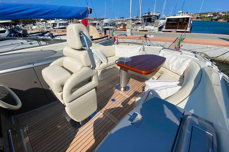  Yacht Photos Pics Luxurious 2008 Riva RivaRama 44 yacht interior with elegant seating and wooden table.
