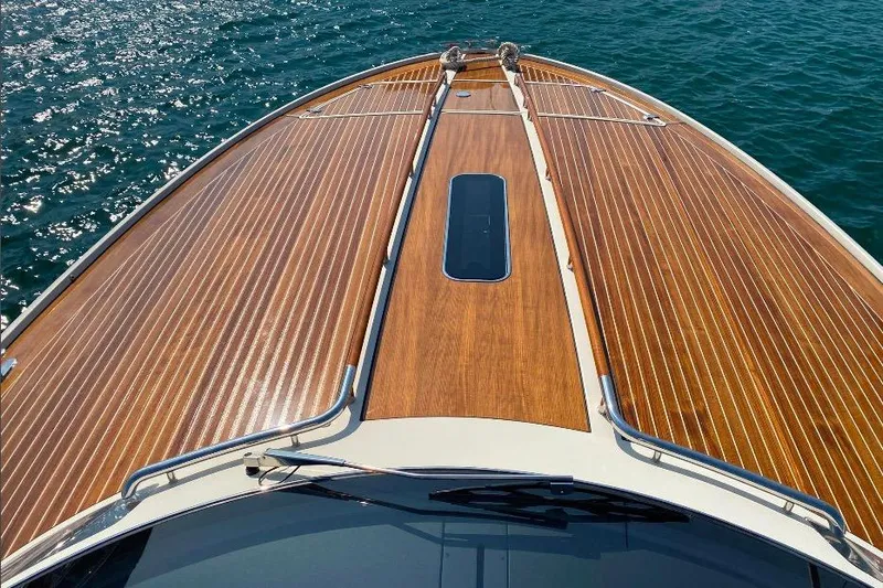  Yacht Photos Pics 2008 Riva RivaRama 44 yacht with sleek wooden deck on sparkling water.