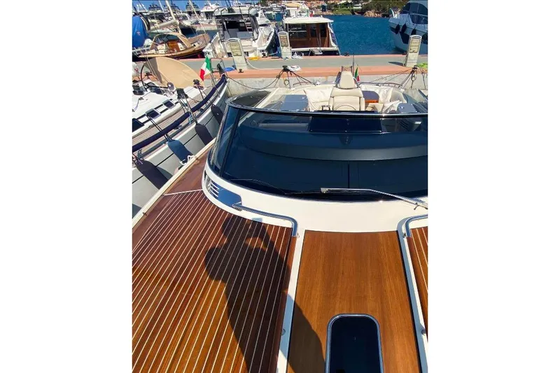  Yacht Photos Pics 2008 Riva RivaRama 44 luxury yacht with sleek wooden deck at marina.