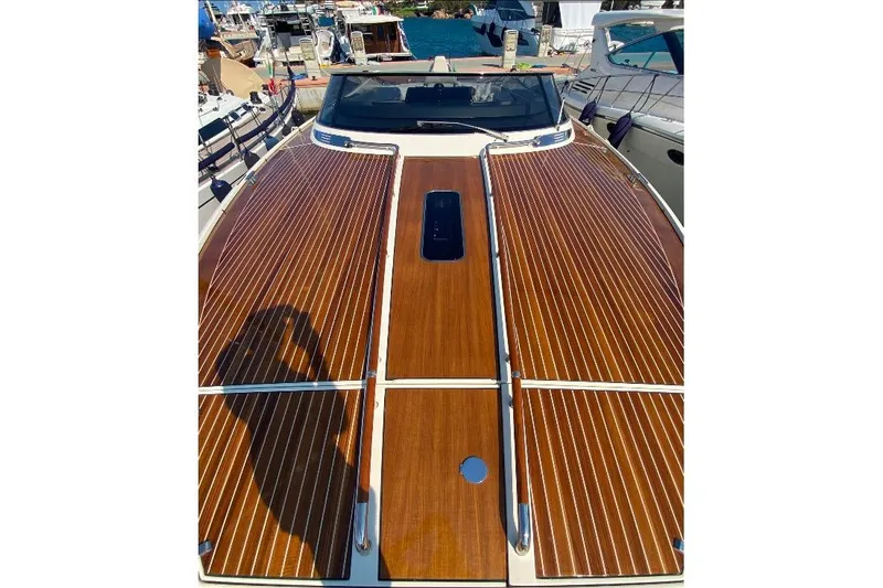  Yacht Photos Pics 2008 Riva RivaRama 44 yacht with polished wooden deck, docked at marina.