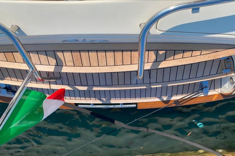  Yacht Photos Pics 2008 Riva RivaRama 44 yacht with Italian flag, wooden deck, and chrome railings.