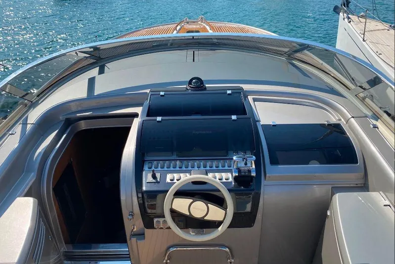  Yacht Photos Pics 2008 Riva RivaRama 44 yacht cockpit with steering wheel and control panel.
