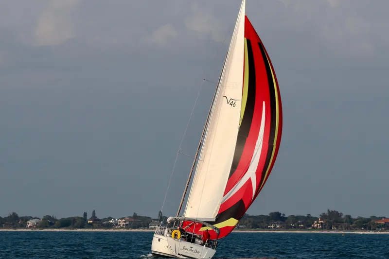  Yacht Photos Pics Sailing yacht Bavaria Vision 46, 2014 model, with vibrant spinnaker on open water.