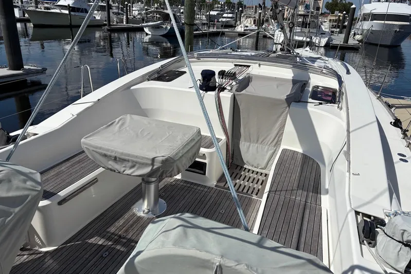  Yacht Photos Pics 2014 Bavaria Vision 46 sailboat cockpit with covered seating, docked at a marina.