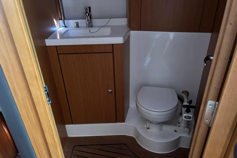  Yacht Photos Pics Bathroom interior of 2014 Bavaria Vision 46 yacht with sink and toilet.