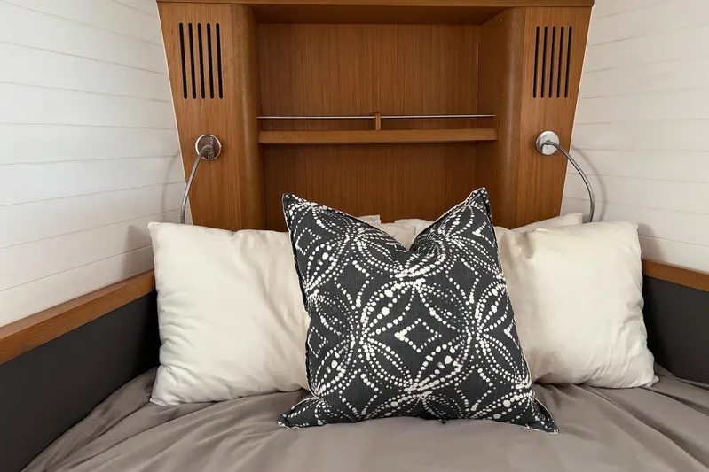  Yacht Photos Pics Cozy cabin interior of 2014 Bavaria Vision 46 yacht with decorative pillows.