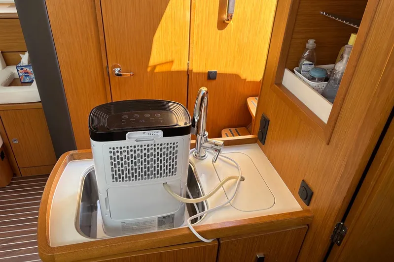  Yacht Photos Pics Compact appliance in Bavaria Vision 46 yacht kitchen, 2014 model, with wooden cabinetry.
