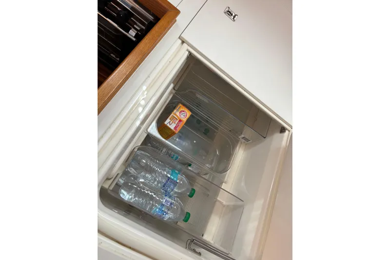  Yacht Photos Pics Refrigerator in 2014 Bavaria Vision 46 yacht with water bottles and baking soda.