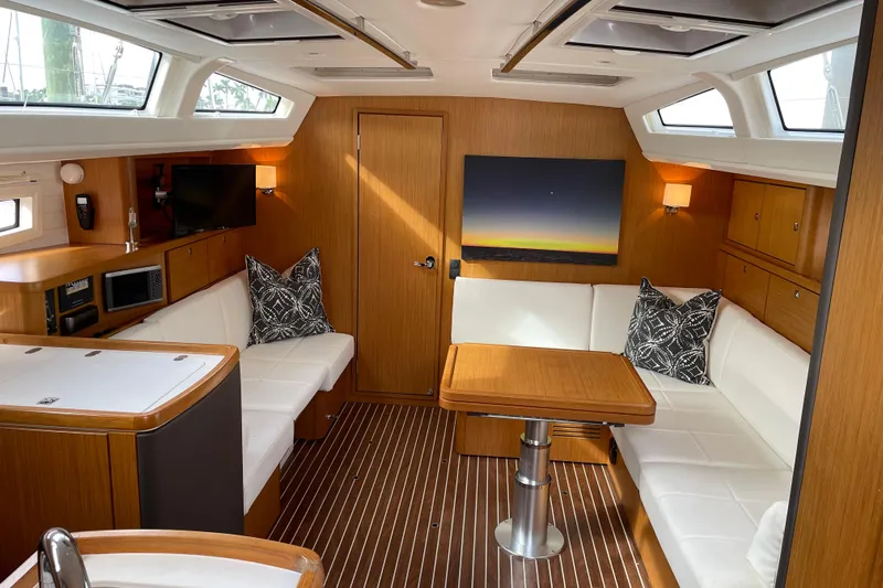  Yacht Photos Pics Luxurious interior of 2014 Bavaria Vision 46 yacht with modern furnishings and wood accents.
