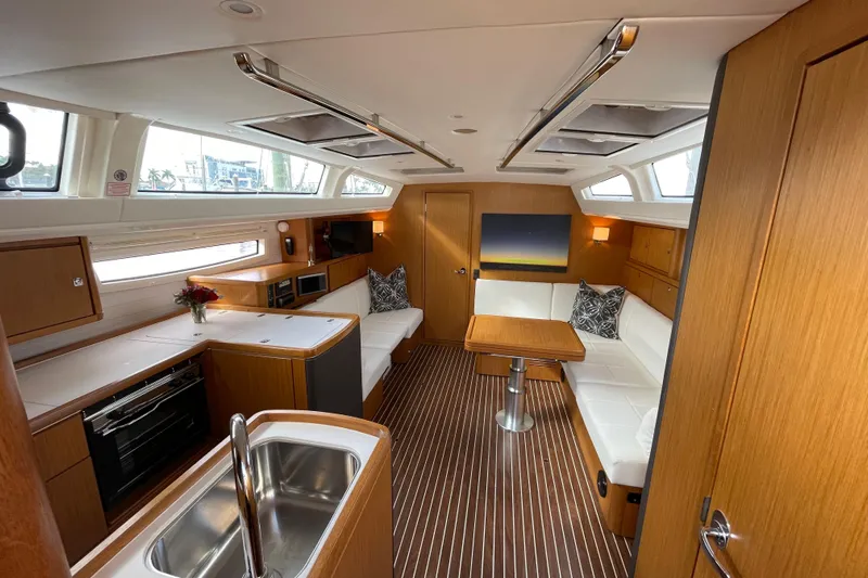  Yacht Photos Pics Luxurious interior of 2014 Bavaria Vision 46 yacht with modern kitchen and seating area.