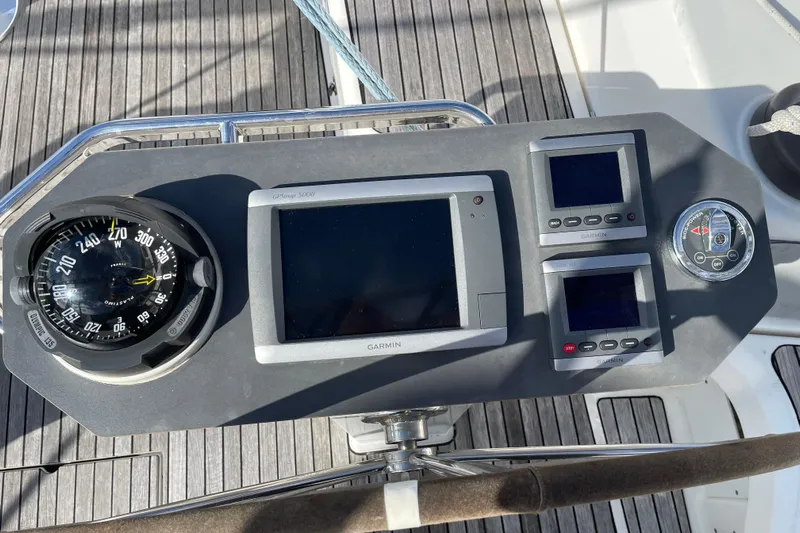  Yacht Photos Pics Control panel of 2014 Bavaria Vision 46 sailboat with compass and Garmin displays.