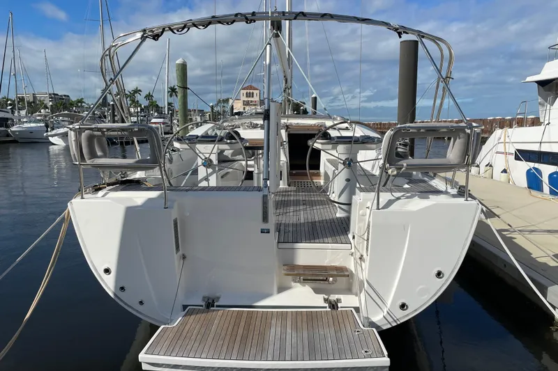  Yacht Photos Pics 2014 Bavaria Vision 46 yacht docked at marina, showcasing spacious deck and modern design.