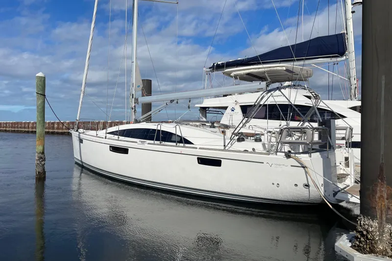  Yacht Photos Pics 2014 Bavaria Vision 46 sailboat docked in a marina under a blue sky.
