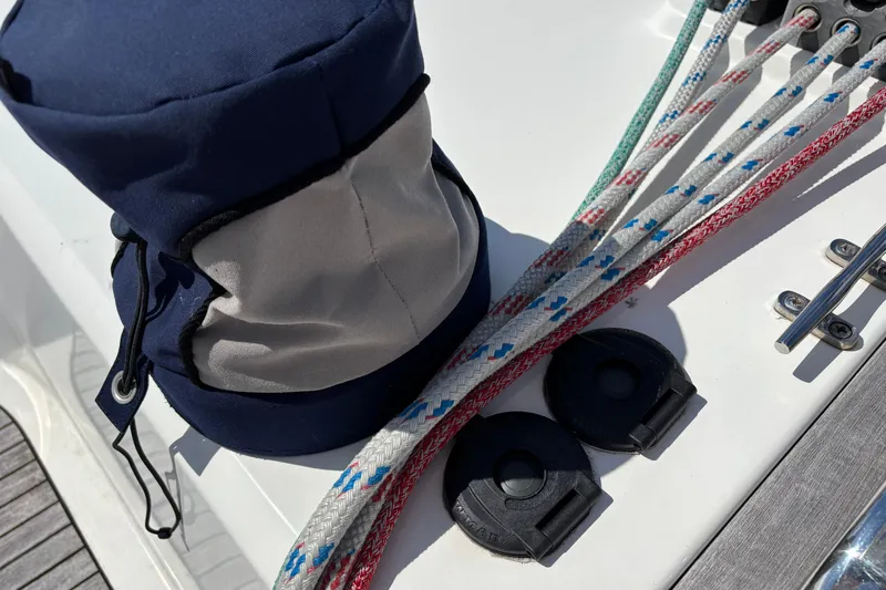  Yacht Photos Pics Sailing equipment on 2014 Bavaria Vision 46 yacht deck, featuring ropes and a navy bag.