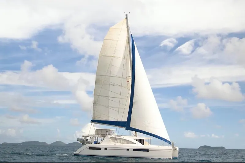 Zumbrota Yacht Photos Pics Sailing catamaran Leopard 48, 2014 model, cruising on open sea under clear skies.