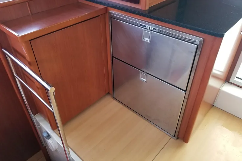 Zumbrota Yacht Photos Pics Modern kitchen area in a 2014 Leopard 48 yacht with stainless steel appliances.