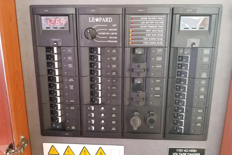 Zumbrota Yacht Photos Pics Electrical control panel on a 2014 Leopard 48 yacht, featuring various switches and indicators.