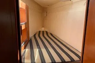 Zumbrota Yacht Photos Pics Interior cabin of 2014 Leopard 48 yacht with striped flooring.