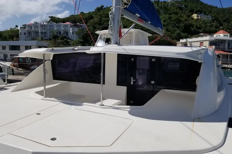 Zumbrota Yacht Photos Pics 2014 Leopard 48 yacht docked, featuring sleek design and spacious deck area.