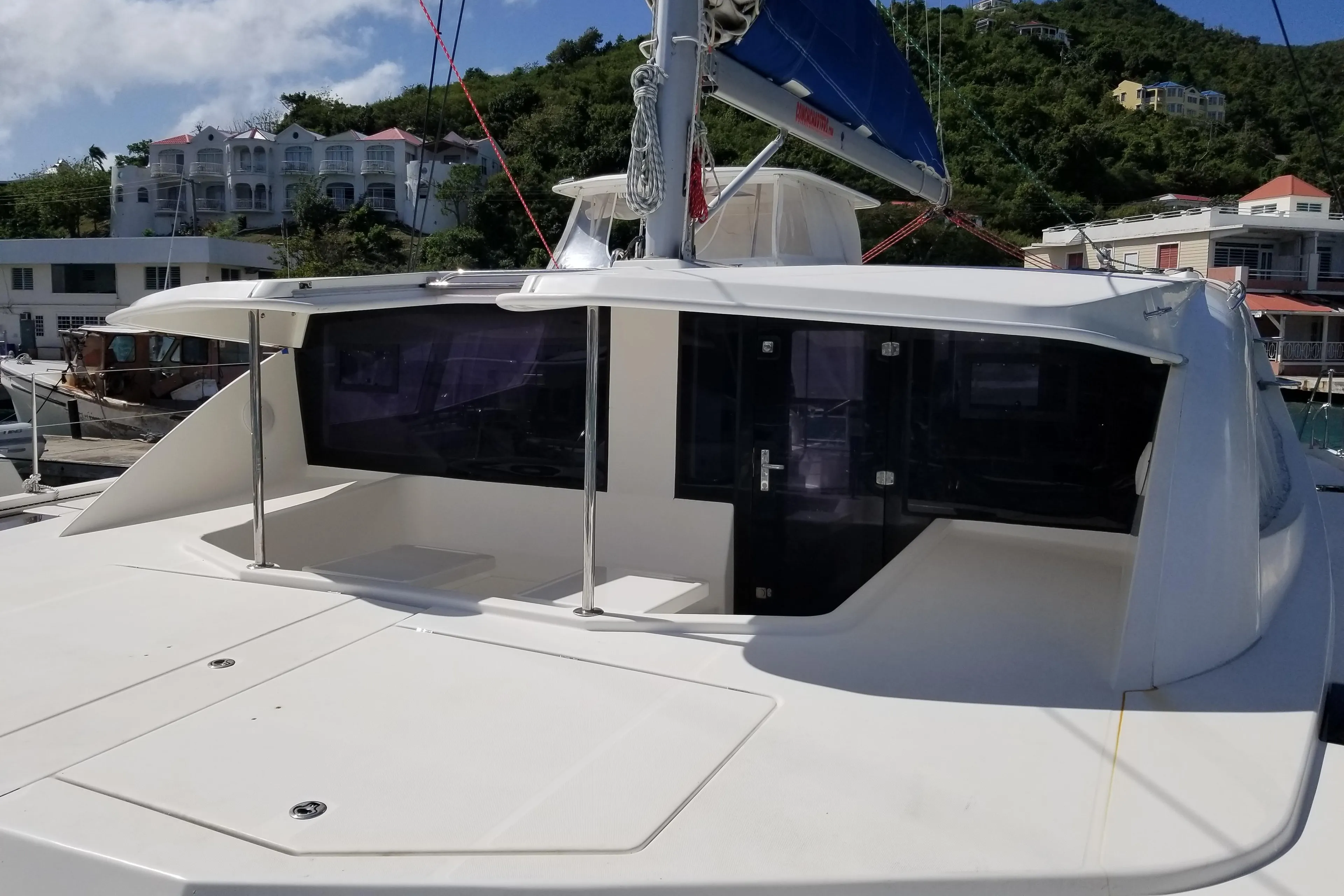2014 Leopard 48 yacht docked, featuring sleek design and spacious deck area.