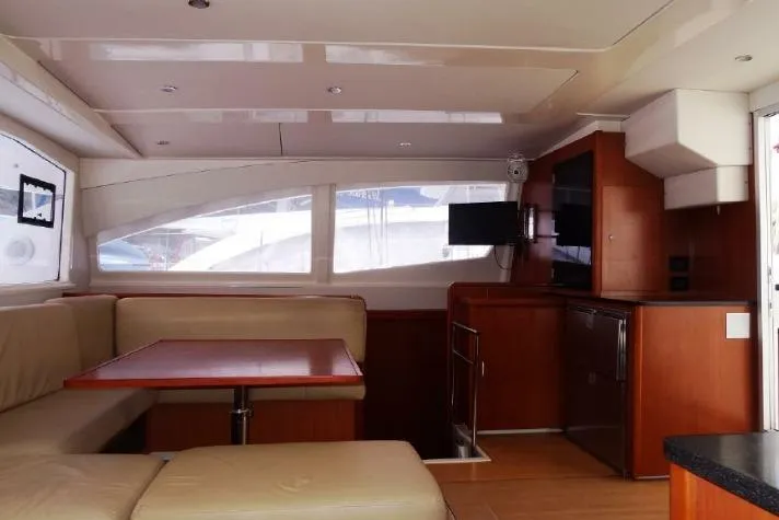 Zumbrota Yacht Photos Pics Interior of a 2014 Leopard 48 yacht with modern seating and entertainment area.