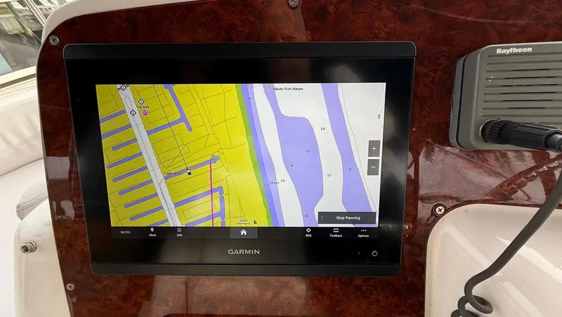 Dazilus Yacht Photos Pics Garmin navigation display on 2001 Silverton 410 Sport Bridge yacht dashboard.