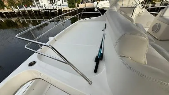 Dazilus Yacht Photos Pics 2001 Silverton 410 Sport Bridge deck with white seating and railing, dockside view.