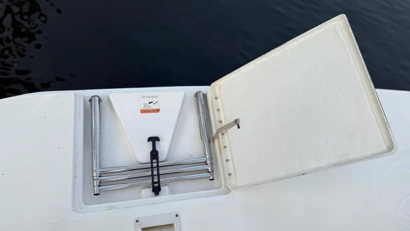 Dazilus Yacht Photos Pics Open hatch on 2001 Silverton 410 Sport Bridge boat, revealing storage compartment.