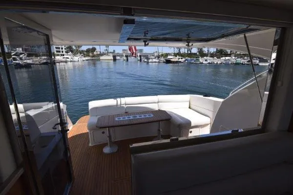No Contingencies Yacht Photos Pics 2012 Riviera 440 Sport Yacht with spacious deck and waterfront view.
