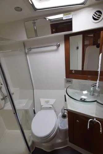 No Contingencies Yacht Photos Pics 2012 Riviera 440 Sport Yacht bathroom with modern fixtures and glass sink.
