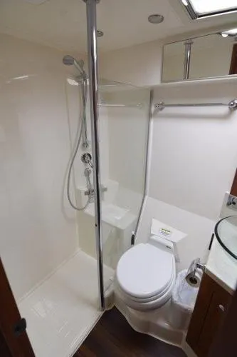 No Contingencies Yacht Photos Pics Bathroom interior of 2012 Riviera 440 Sport Yacht with shower and toilet.