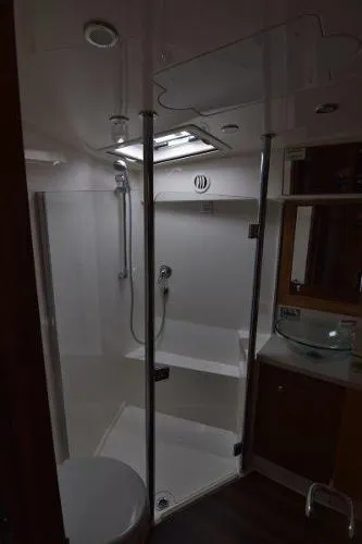 No Contingencies Yacht Photos Pics Bathroom interior of 2012 Riviera 440 Sport Yacht with shower and sink.