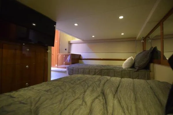 No Contingencies Yacht Photos Pics Interior of 2012 Riviera 440 Sport Yacht with cozy twin beds and ambient lighting.