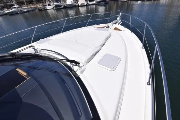 No Contingencies Yacht Photos Pics 2012 Riviera 440 Sport Yacht bow view, docked in marina.