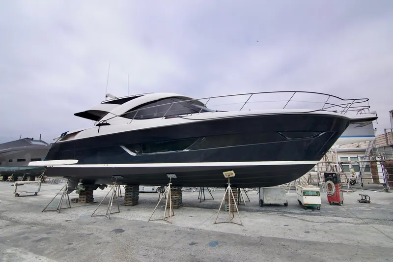No Contingencies Yacht Photos Pics 2012 Riviera 440 Sport Yacht on dry dock, sleek design, ready for maintenance.