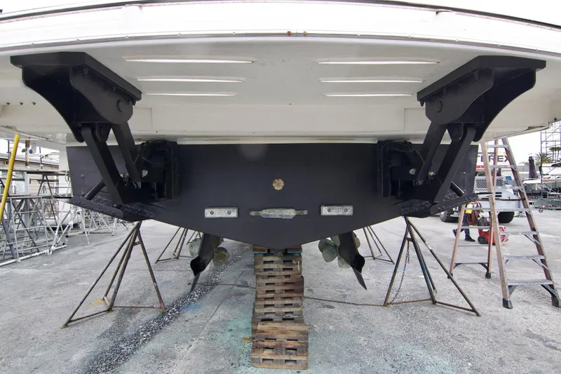 No Contingencies Yacht Photos Pics Riviera 440 Sport Yacht 2012, rear view, dry docked, showing propellers and supports.