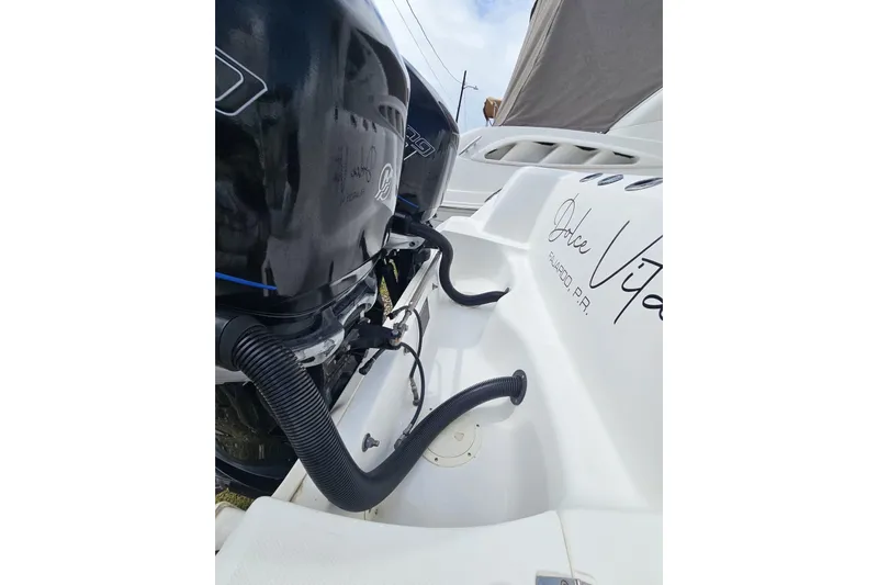  Yacht Photos Pics 2013 Boston Whaler 320 Outrage boat with dual engines, featuring "Dolce Vita" text.