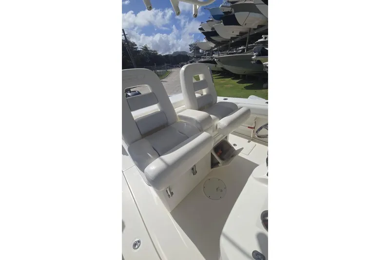  Yacht Photos Pics 2013 Boston Whaler 320 Outrage boat interior with dual white seats.