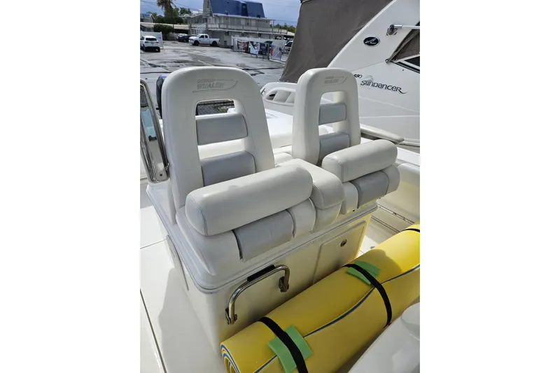  Yacht Photos Pics 2013 Boston Whaler 320 Outrage boat seats with yellow flotation device.