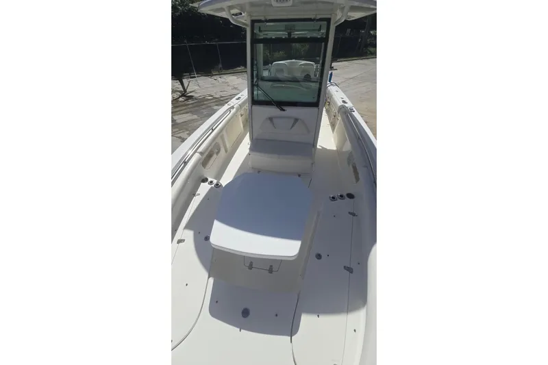  Yacht Photos Pics 2013 Boston Whaler 320 Outrage boat interior with seating and console.