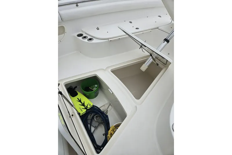  Yacht Photos Pics 2013 Boston Whaler 320 Outrage storage compartments with boating gear and accessories.