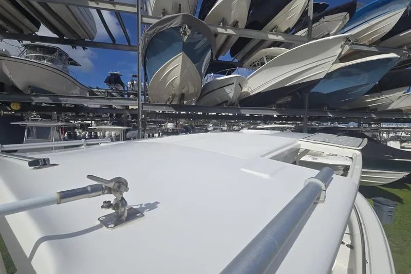  Yacht Photos Pics 2013 Boston Whaler 320 Outrage in dry storage with multiple boats stacked above.